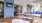 a patio with a large blue wall and a large tv