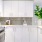a kitchen with white cabinets