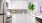 a kitchen with white cabinets