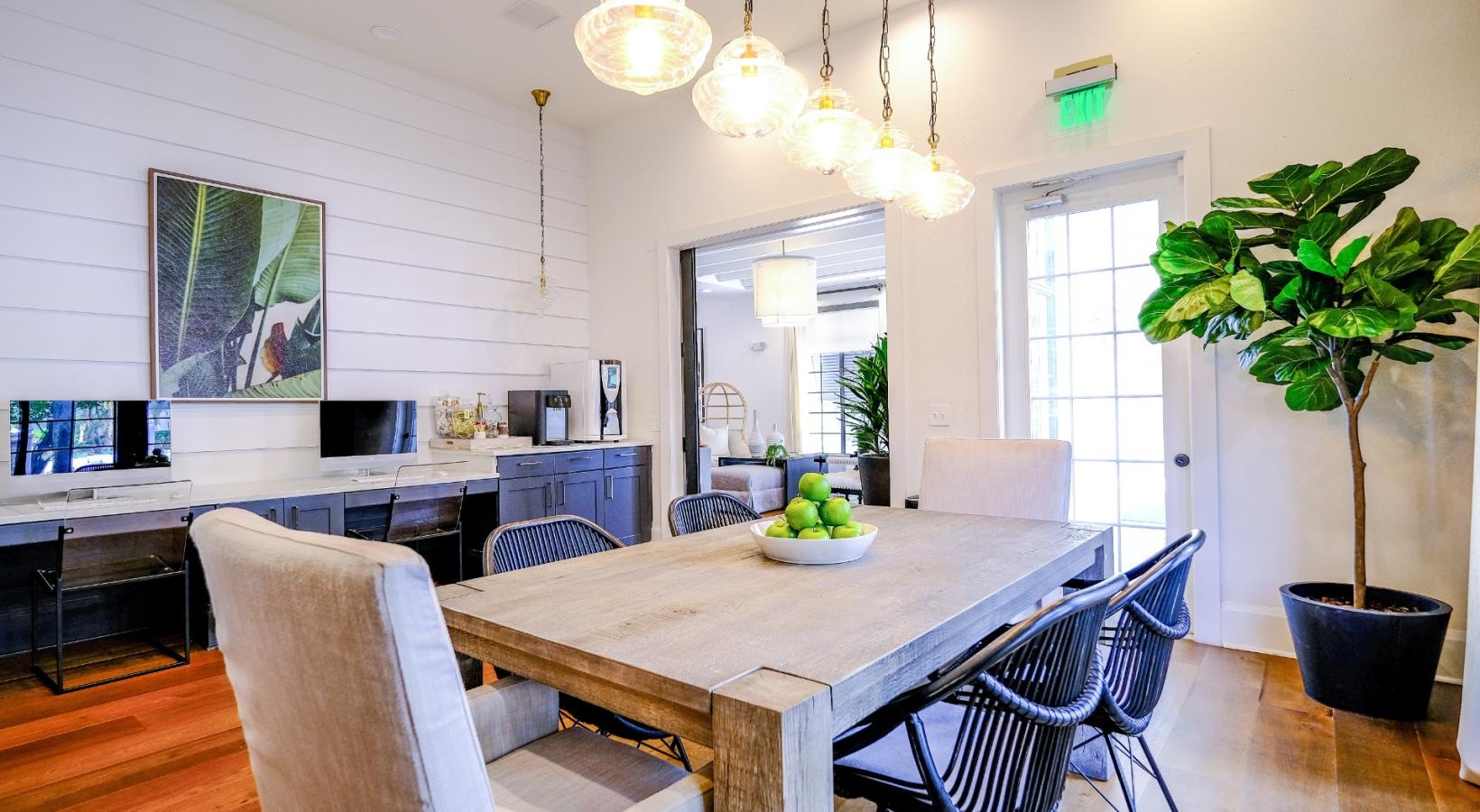 Take advantage of all The Sophia at Abacoa has to offer a community dining room with a chandelier and a table with chairs