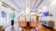 a room with two chairs and a table with a plant