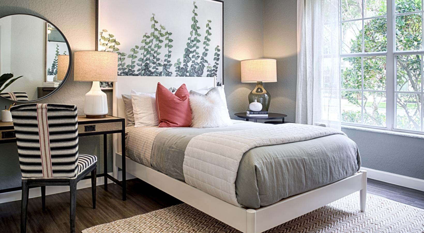 Beautiful bedrooms to fit every need a bedroom with a bed and lamps