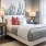 a bedroom with a bed and lamps