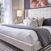 bedroom with large bed lamps and window