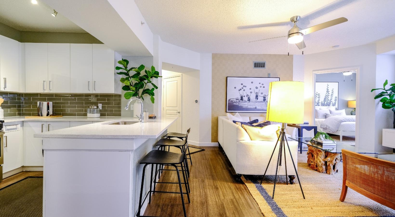 Beautiful living areas to match your lifestyle a kitchen with a table and chairs