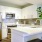 a kitchen with white cabinets