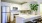 a kitchen with white cabinets