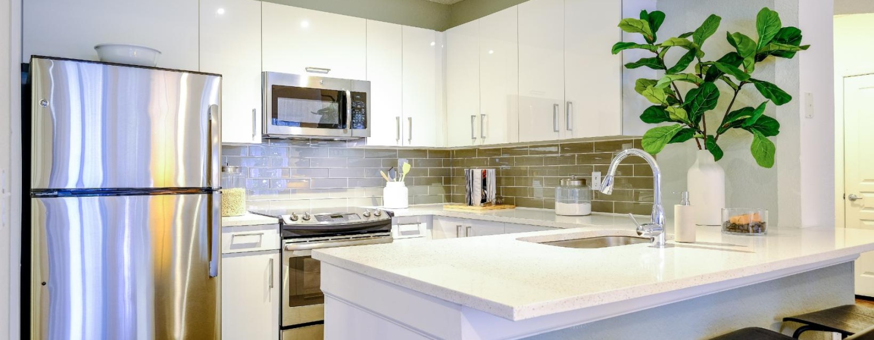 a kitchen with white cabinets