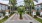 a street with palm trees and buildings