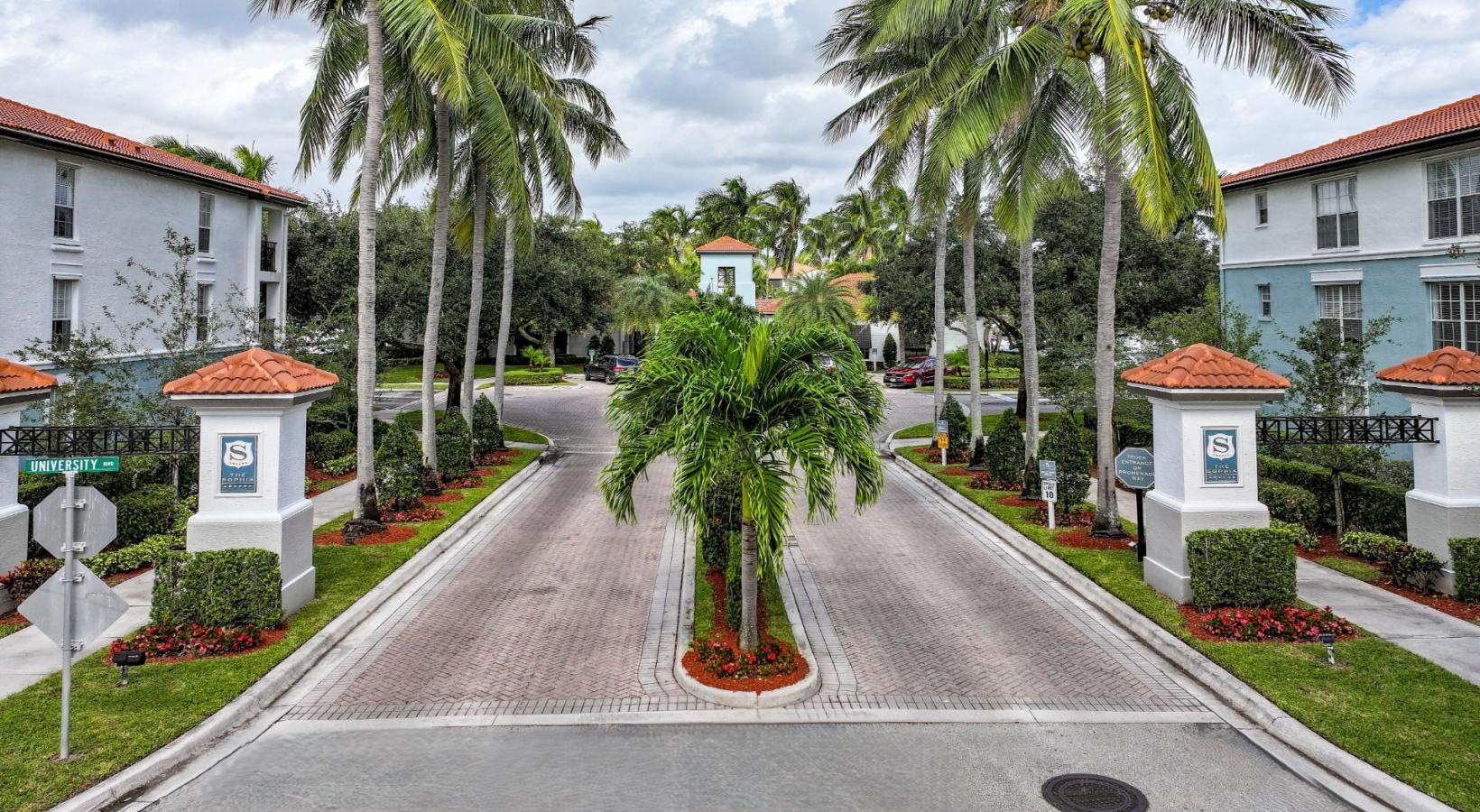 The essence of exceptional living a street with palm trees and buildings