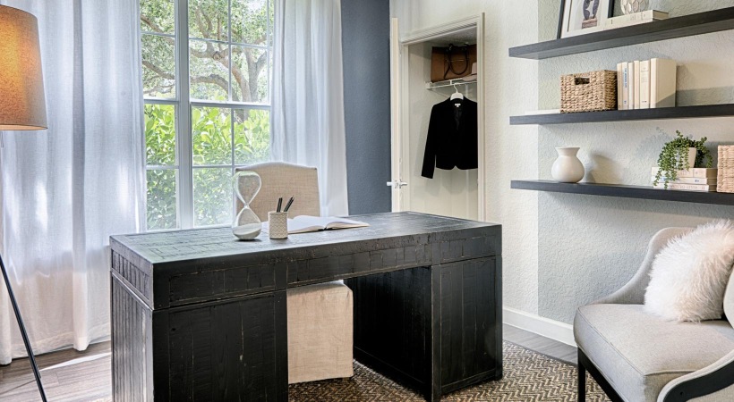 an office or den with a desk and a chair