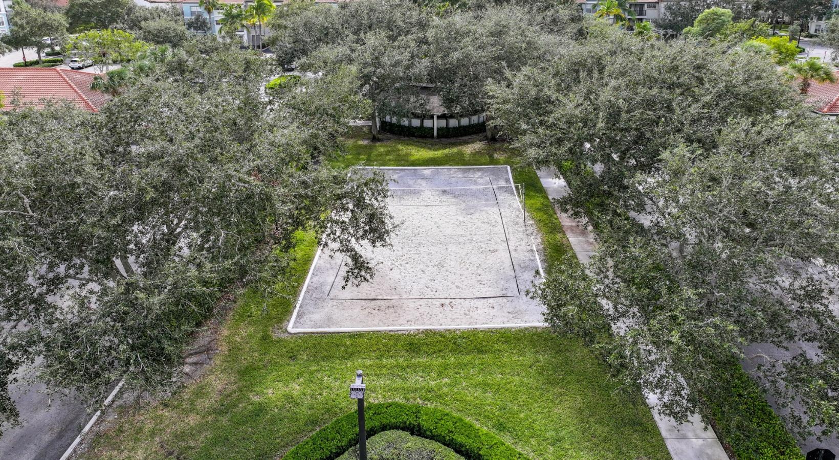 Settle into comfort at The Sophia at Abacoa a garden with a path