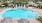a pool with chairs around it