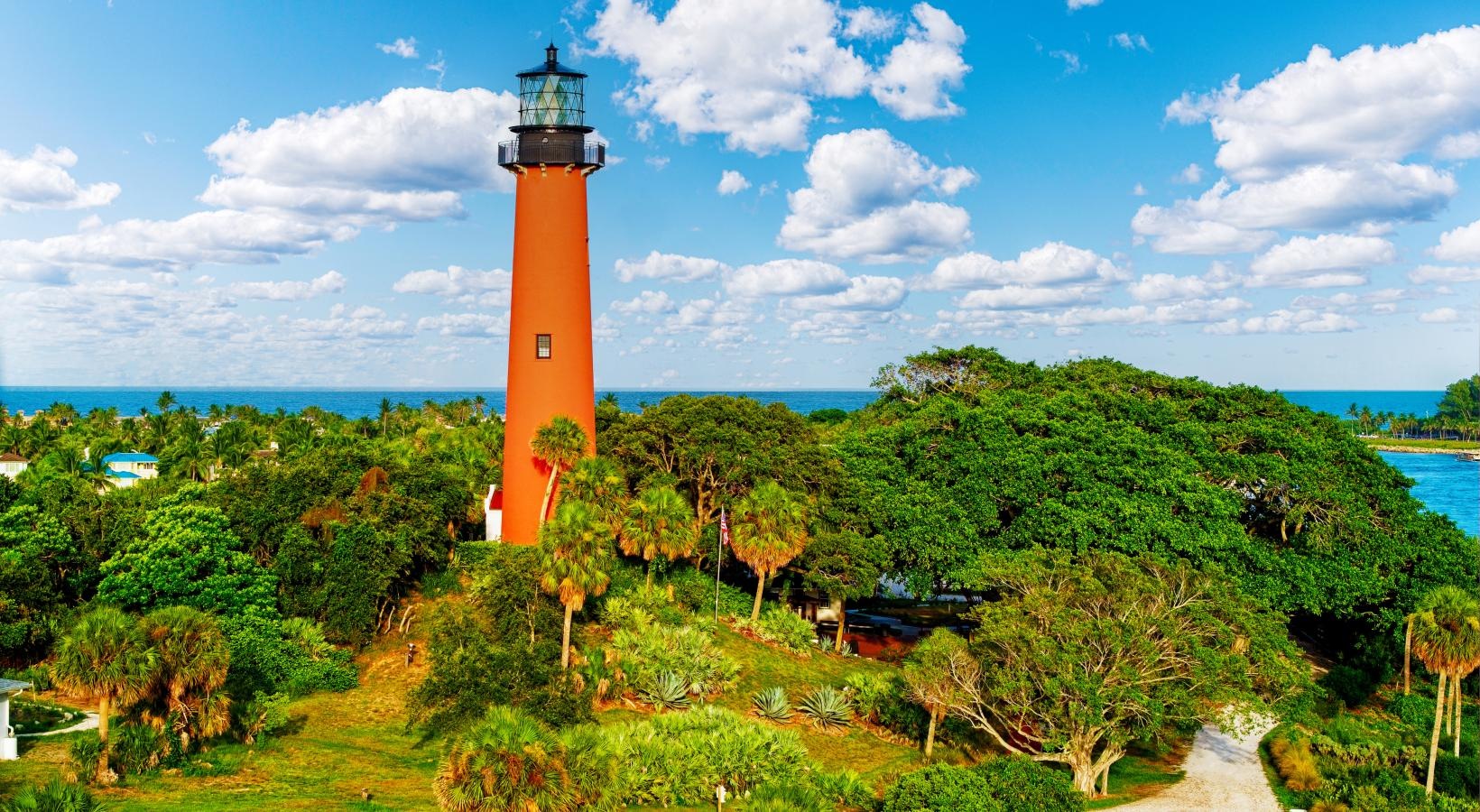 The essence of exceptional living a lighthouse surrounded by trees and bushes