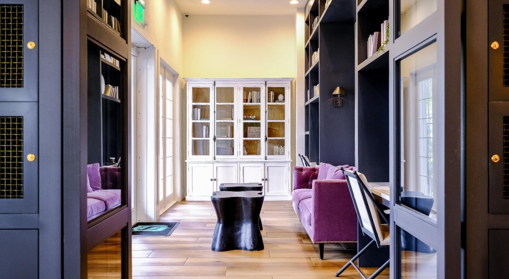 State-of-the-art amenities a clubhouse entryway with a table and chairs